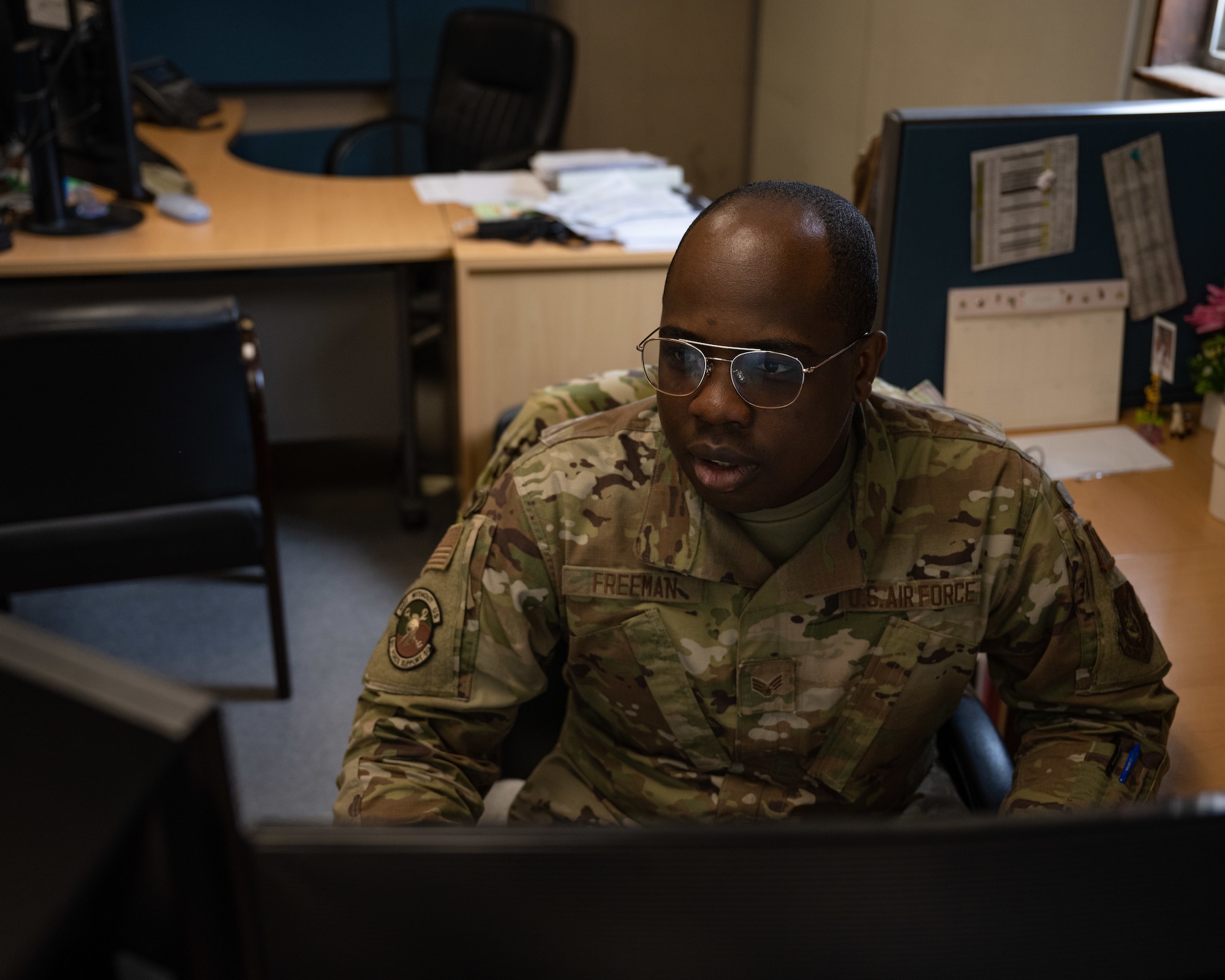 Senior Airman Bernard Freeman, 8th Force Support Squadron personnel systems manager, reviews personnel records at Kunsan Air Base, Republic of Korea.