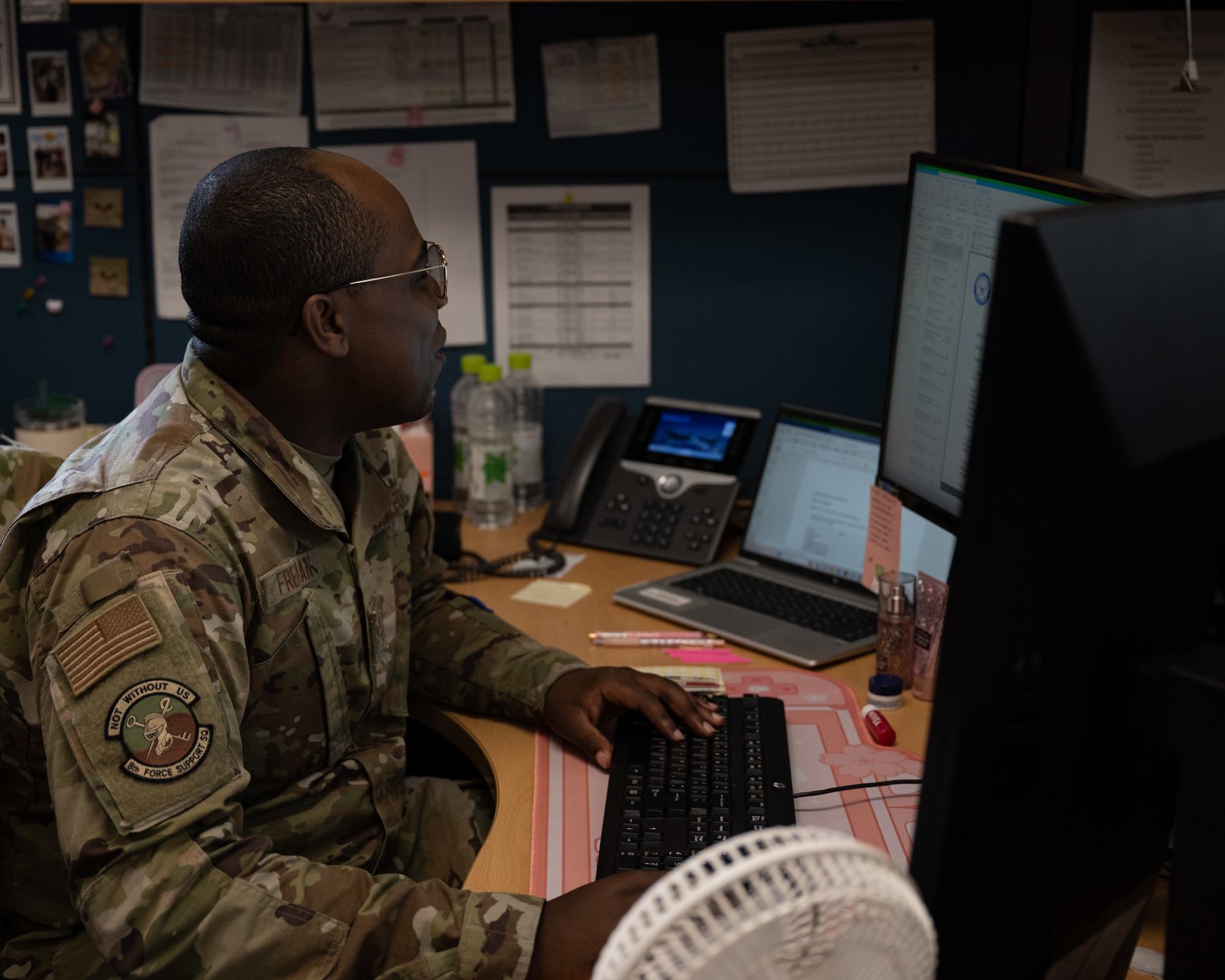 Senior Airman Bernard Freeman, 8th Force Support Squadron personnel systems manager, reviews personnel records at Kunsan Air Base, Republic of Korea