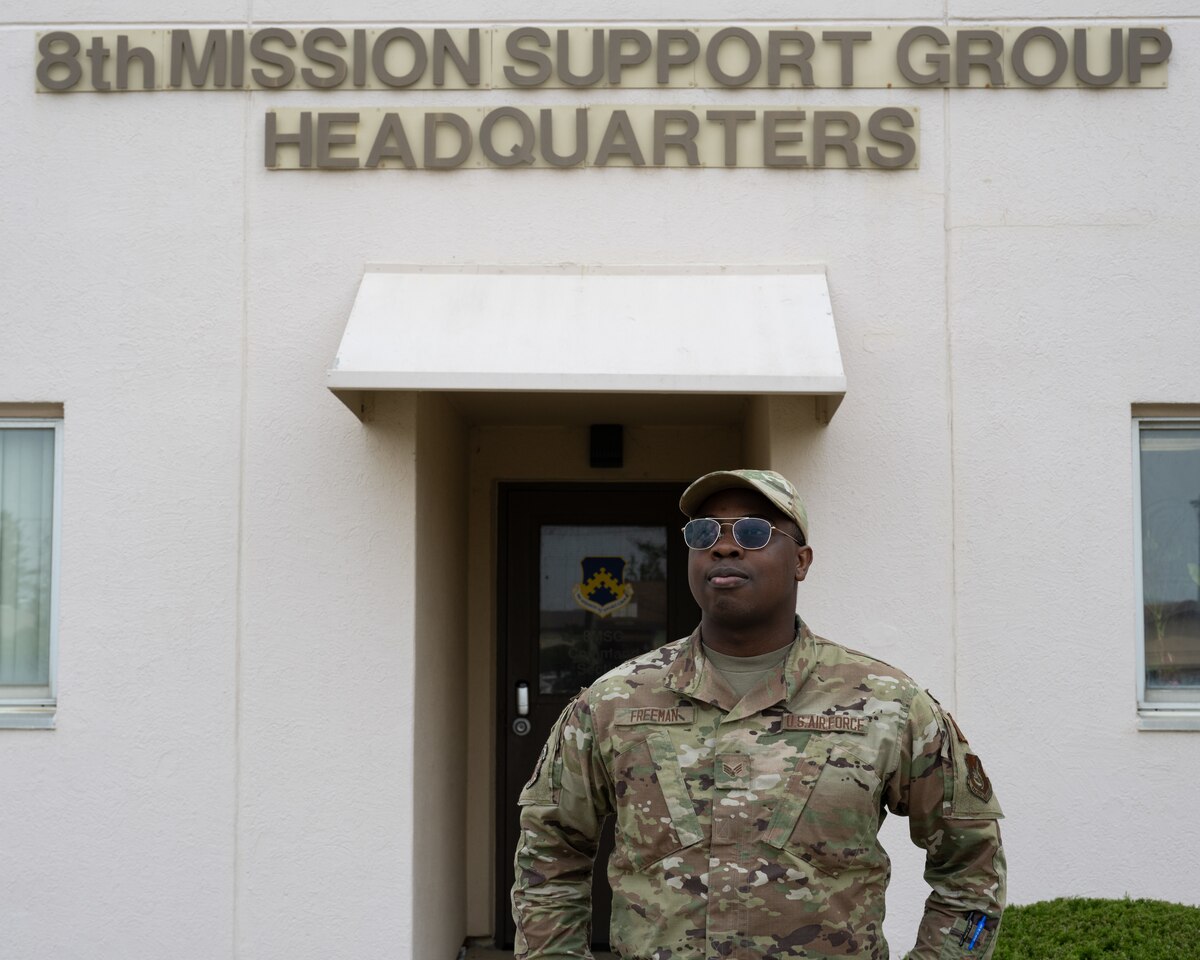 Senior Airman Bernard Freeman, 8th Force Support Squadron personnel systems manager, stands in front of the 8th Mission Support Group headquarters at Kunsan Air Base, Republic of Korea.
