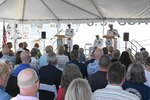 Cmdr. Thomas Martin, commanding officer of U.S. Coast Guard Cutter Confidence (WMEC 619), addresses the crowd, May 2, 2024, during the cutter's heritage recognition ceremony in Cape Canaveral, Florida. Confidence was recognized for 58 years of service to the nation in the presence of current and former crew members, family, and friends before it was placed in commission, special status. (U.S. Coast Guard photo by Petty Officer 2nd Class Brandon Hillard)