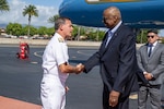 Secretary of Defense Lloyd J. Austin III is greeted by Navy Adm. John Aquilino, 26th Commander of U.S. Indo-Pacific Command, upon arrival to Joint Base Pearl Harbor-Hickam, Hawaii,  for the Indo-Pacom change of command ceremony, May 1, 2024.