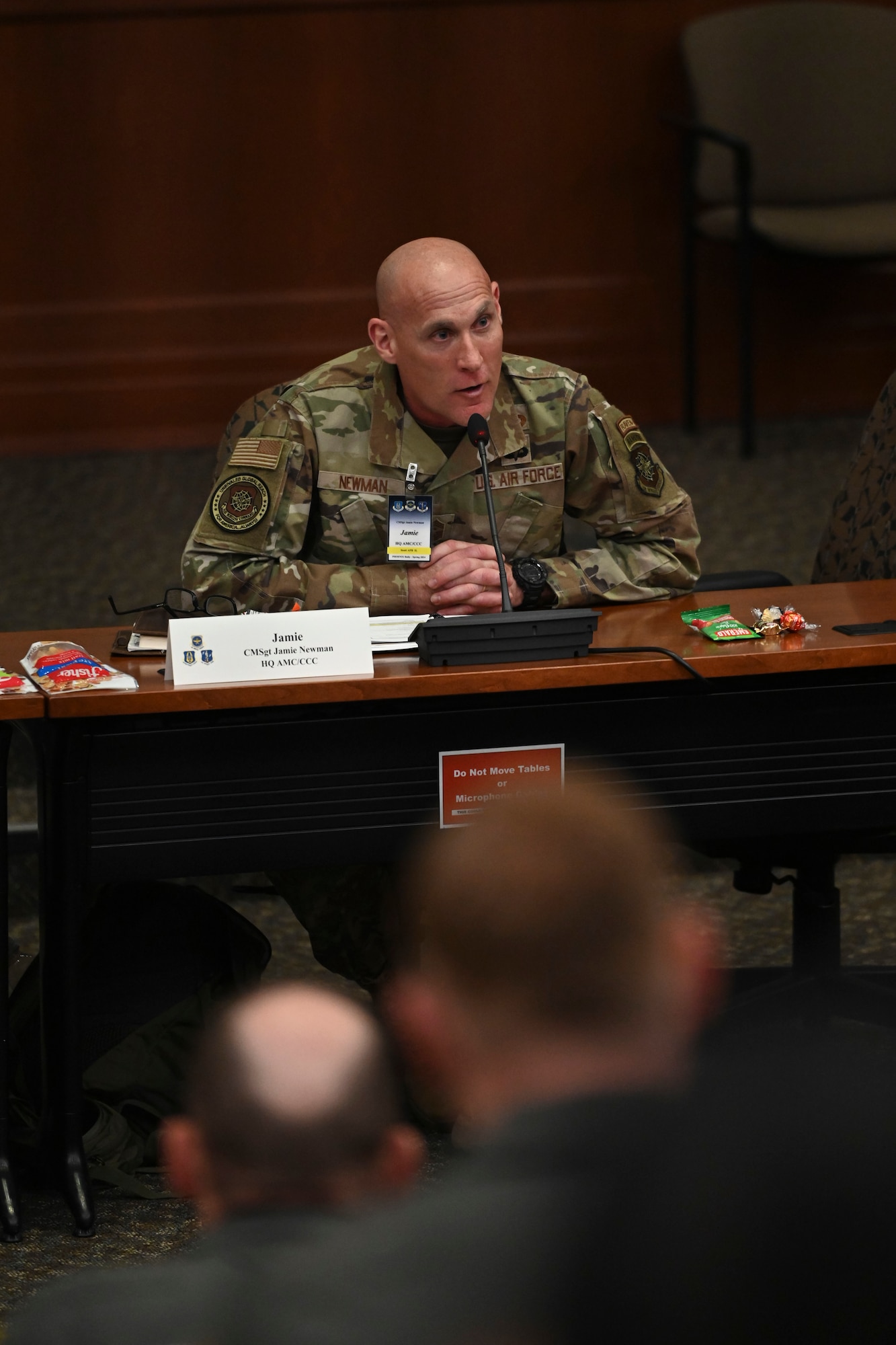 U.S. Air Force Chief Master Sgt. Jamie Newman, Air Mobility Command command chief, listens during remarks during the Phoenix Rally conference at MacDill Air Force Base, Florida, April 29, 2024. Spring Phoenix Rally brought together more than 250 Total Force Mobility Air Force leaders and spouses to discuss Warrior Heart, Air Mobility Command's strategy and priorities, and how to work together to ensure the Mobility Air Force is ready to deliver Rapid Global Mobility across the Joint Force. (U.S. Air Force photo by Senior Airman Jessica Do)