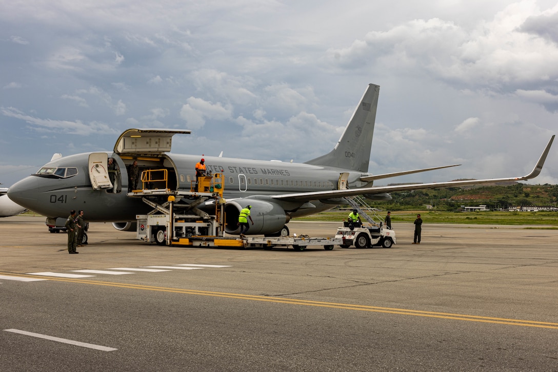 U.S. Marines with Marine Transport Squadron 1, Marine Aircraft Group 41, 4th Marine Aircraft Wing, Marine Forces Reserve, and Papua New Guinea airport personnel, prepare to unload gear and equipment from a C-40A assigned to VMR-1, MAG-41, in preparation for a humanitarian aid and disaster relief exercise at Jacksons International Airport, Port Moresby, Papua New Guinea, April 30, 2024. The HADR exercise will be conducted in coordination with the Papua New Guinea Defense Force and U.S. Embassy in Port Moresby, with a focus on projecting select Role II medical, logistics, and Marine Air-Ground Task Force command and control capabilities off-continent, to validate HADR training and readiness. MRF-D 24.3 remains committed to maintaining readiness and fostering partnerships to ensure a swift and effective response to humanitarian crises wherever and whenever they may occur. (U.S. Marine Corps photo by Cpl. Juan Torres)