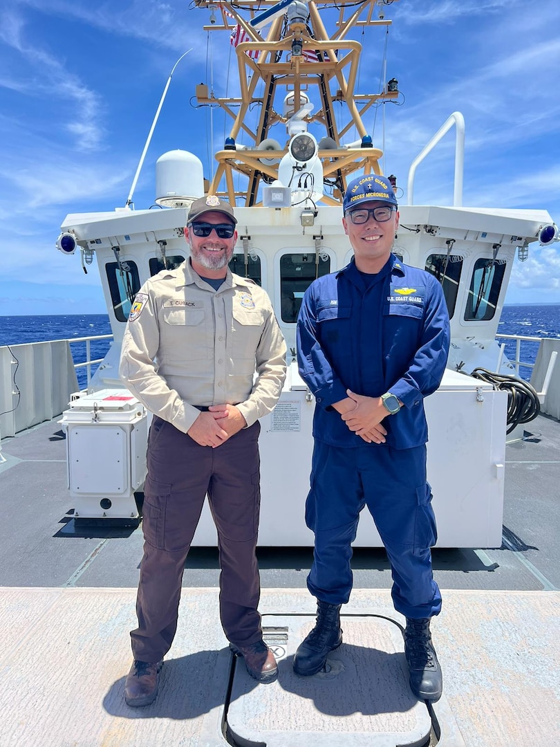 Chaplain Richard Min and Officer Cusak of U.S. Fish and Wildlife join the crew of the USCGC Oliver Henry (WPC 1140) as they patrol the Northern Mariana Islands on April 23, 2024. For nearly eight decades, the U.S. Coast Guard's presence in the Northern Mariana Islands has been one of partnership and stewardship of the marine environment. (U.S. Coast Guard photo by Lt. Ray Cerrato)