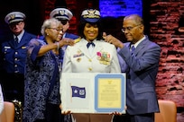 CAPT Zeita Merchant, the outgoing Coast Guard Sector New York commander is shown being frocked to rear admiral lower half, during a ceremony at the Richard Rodgers Theatre in Manhattan, New York, April 22, 2024. Merchant is the first the first African American woman to achieve this rank in the nearly 234-year history of the military service. (U.S. Coast Guard photo by Petty Officer 2nd Class Ryan Schultz)