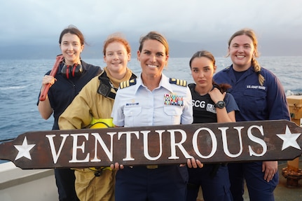 The women of the U.S. Coast Guard Cutter Venturous (WMEC 625) pose for a photo at sea in the Caribbean on March 15, 2024, in honor of Women's History Month. Pictured from left to right: Ensign Claire Portigue, Lt. j.g Josephine St. Ledger, Cmdr. Karen L. Kutkiewicz (Center), Lt. j.g Kristin Heinkel, Ensign Molly McVay. ( U.S. Coast Guard photo by Petty Officer 2nd Class Kekoa Taijeron)