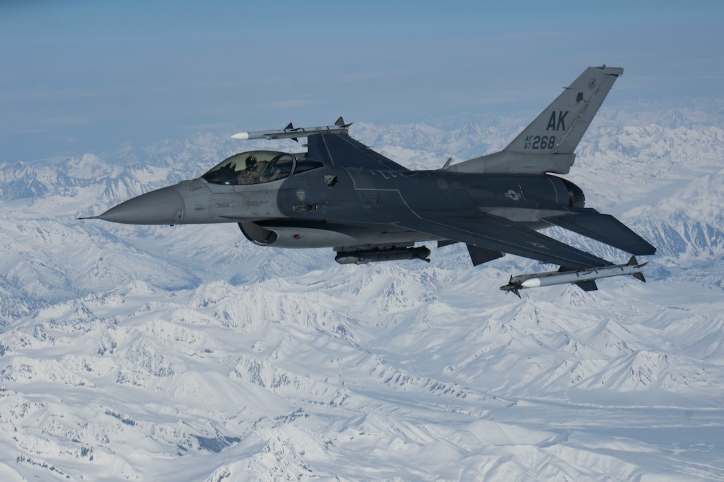 An F-16 Fighting Falcon, assigned to the 354th Fighter Wing, Eielson Air Force Base, Alaska, flies over the Joint Pacific-Alaska Range Complex, Alaska,