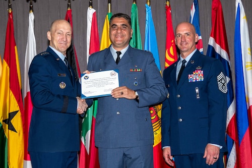 Air Force Chief of Staff Gen. David Allvin and Chief Master Sergeant of the Air Force David Flosi induct Chief Warrant Officer (retired) Mowafaq Mansour Diyab Almustafa, Chief Master Sergeant of the Royal Jordanian Air Force, into the 2024 CSAF & CMSAF International Honor Roll at Maxwell Air Force Base, Ala., Apr. 19, 2024. International Honor Roll recognizes former Air University students who rose to the equivalent level of Chief of Staff or higher or Chief Master Sergeant of the Air Force or higher in their respective services. (US Air Force photo by Melanie Rodgers Cox)