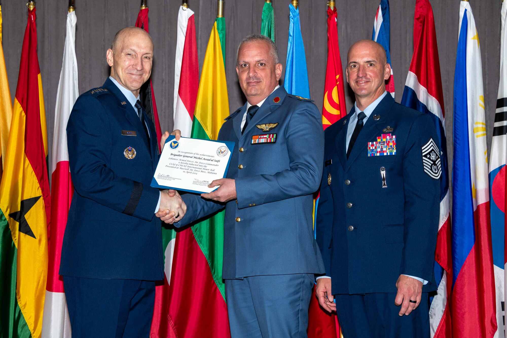 Air Force Chief of Staff Gen. David Allvin and Chief Master Sergeant of the Air Force David Flosi induct Brig. Gen. Michel Assad-al Saifi, Lebanese Armed Forces Air Force Commander, into the 2024 CSAF & CMSAF International Honor Roll at Maxwell Air Force Base, Ala., Apr. 19, 2024. International Honor Roll recognizes former Air University students who rose to the equivalent level of Chief of Staff or higher or Chief Master Sergeant of the Air Force or higher in their respective services. (US Air Force photo by Melanie Rodgers Cox)