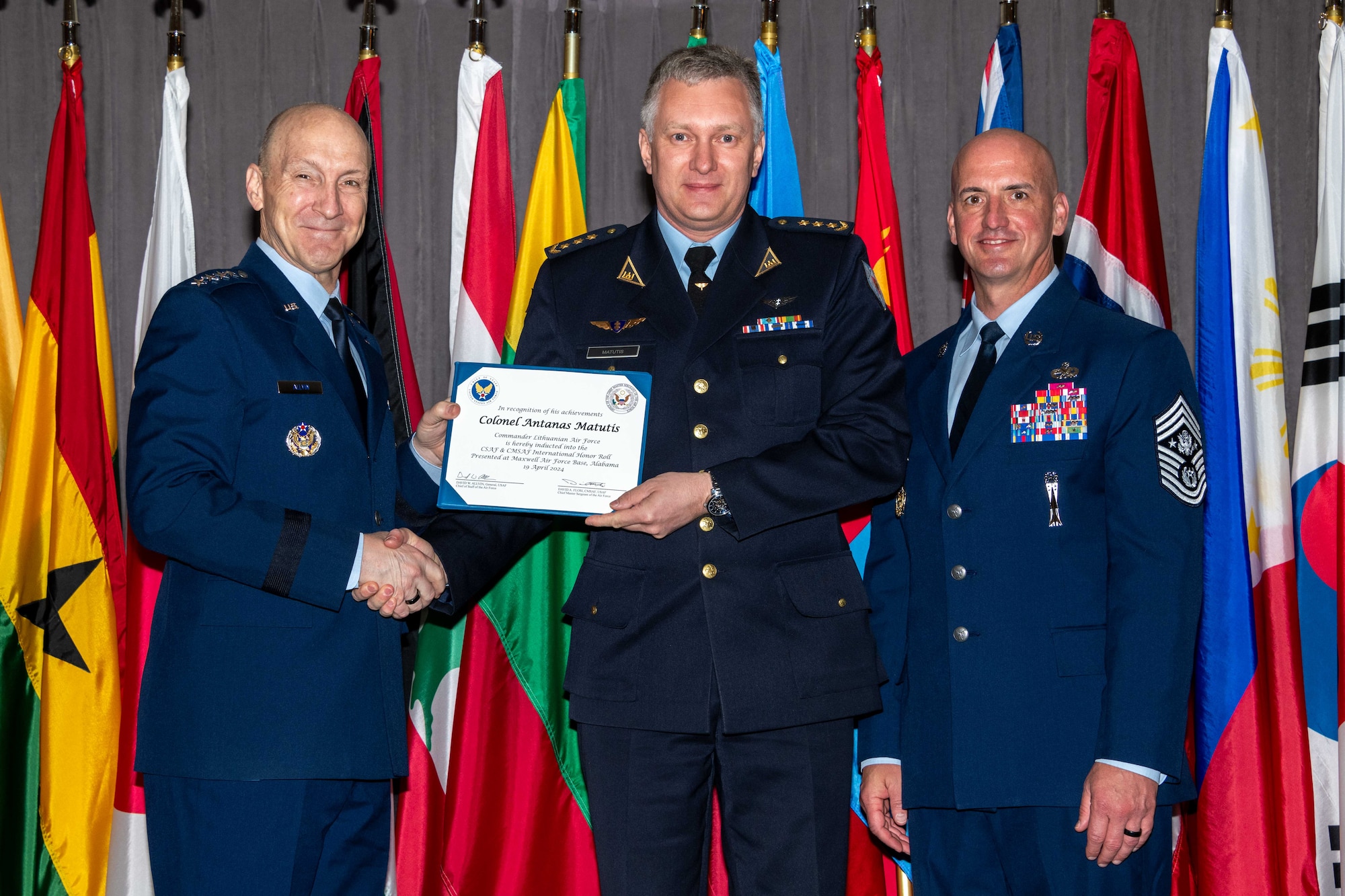 Air Force Chief of Staff Gen. David Allvin and Chief Master Sergeant of the Air Force David Flosi induct Col. Antanas Matutis, Commander Lithuanian Air Force, into the 2024 CSAF & CMSAF International Honor Roll at Maxwell Air Force Base, Ala., Apr. 19, 2024. International Honor Roll recognizes former Air University students who rose to the equivalent level of Chief of Staff or higher or Chief Master Sergeant of the Air Force or higher in their respective services. (US Air Force photo by Melanie Rodgers Cox)