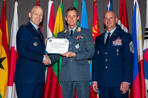Air Force Chief of Staff Gen. David Allvin and Chief Master Sergeant of the Air Force David Flosi induct Maj. Gen. Rolf Folland, Chief of the Royal Norwegian Air Force, into the 2024 CSAF & CMSAF International Honor Roll at Maxwell Air Force Base, Ala., Apr. 19, 2024. International Honor Roll recognizes former Air University students who rose to the equivalent level of Chief of Staff or higher or Chief Master Sergeant of the Air Force or higher in their respective services. (US Air Force photo by Melanie Rodgers Cox)