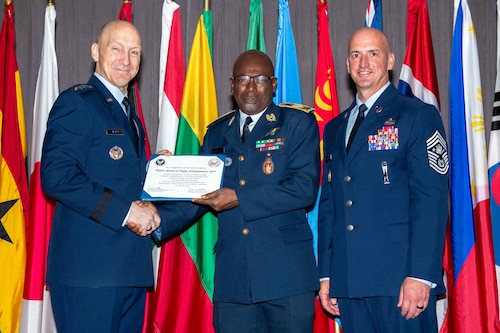 Air Force Chief of Staff Gen. David Allvin and Chief Master Sergeant of the Air Force David Flosi induct Maj. Gen. Papa Souleymane Sarr, former Senegalese Air Force Chief of Staff, into the 2024 CSAF & CMSAF International Honor Roll at Maxwell Air Force Base, Ala., Apr. 19, 2024. Sarr is the current Ambassador to International Civil Aviation Organization (ICAO), Montreal, Canada. International Honor Roll recognizes former Air University students who rose to the equivalent level of Chief of Staff or higher or Chief Master Sergeant of the Air Force or higher in their respective services. (US Air Force photo by Melanie Rodgers Cox)