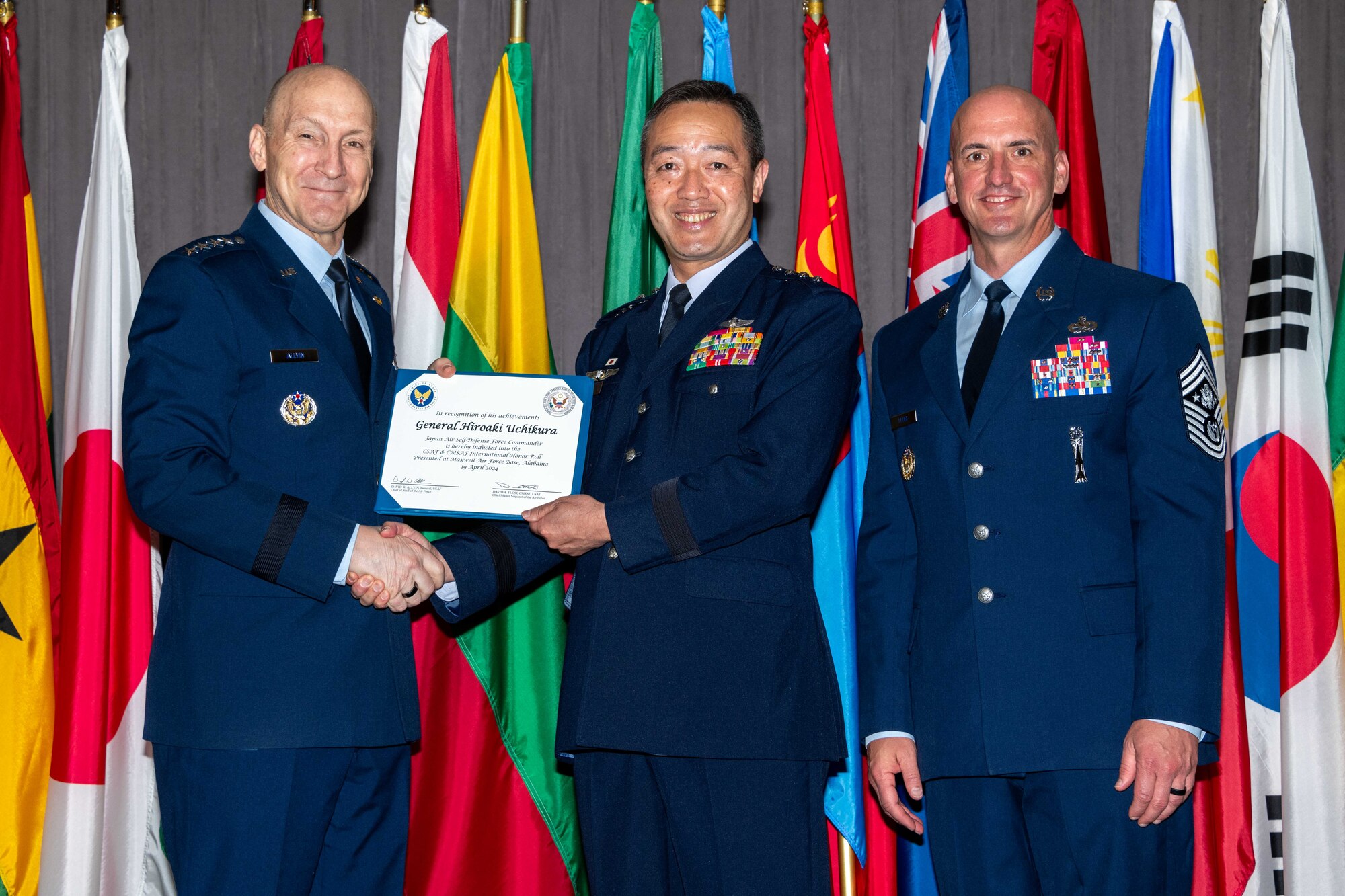 Air Force Chief of Staff Gen. David Allvin and Chief Master Sergeant of the Air Force David Flosi induct Gen. Hiroaki Uchikura, Chief of Staff Koku-Jietai (Japan Air Self Defense Force),

into the 2024 CSAF & CMSAF International Honor Roll at Maxwell Air Force Base, Ala., Apr. 19, 2024. International Honor Roll recognizes former Air University students who rose to the equivalent level of Chief of Staff or higher or Chief Master Sergeant of the Air Force or higher in their respective services. (US Air Force photo by Melanie Rodgers Cox)