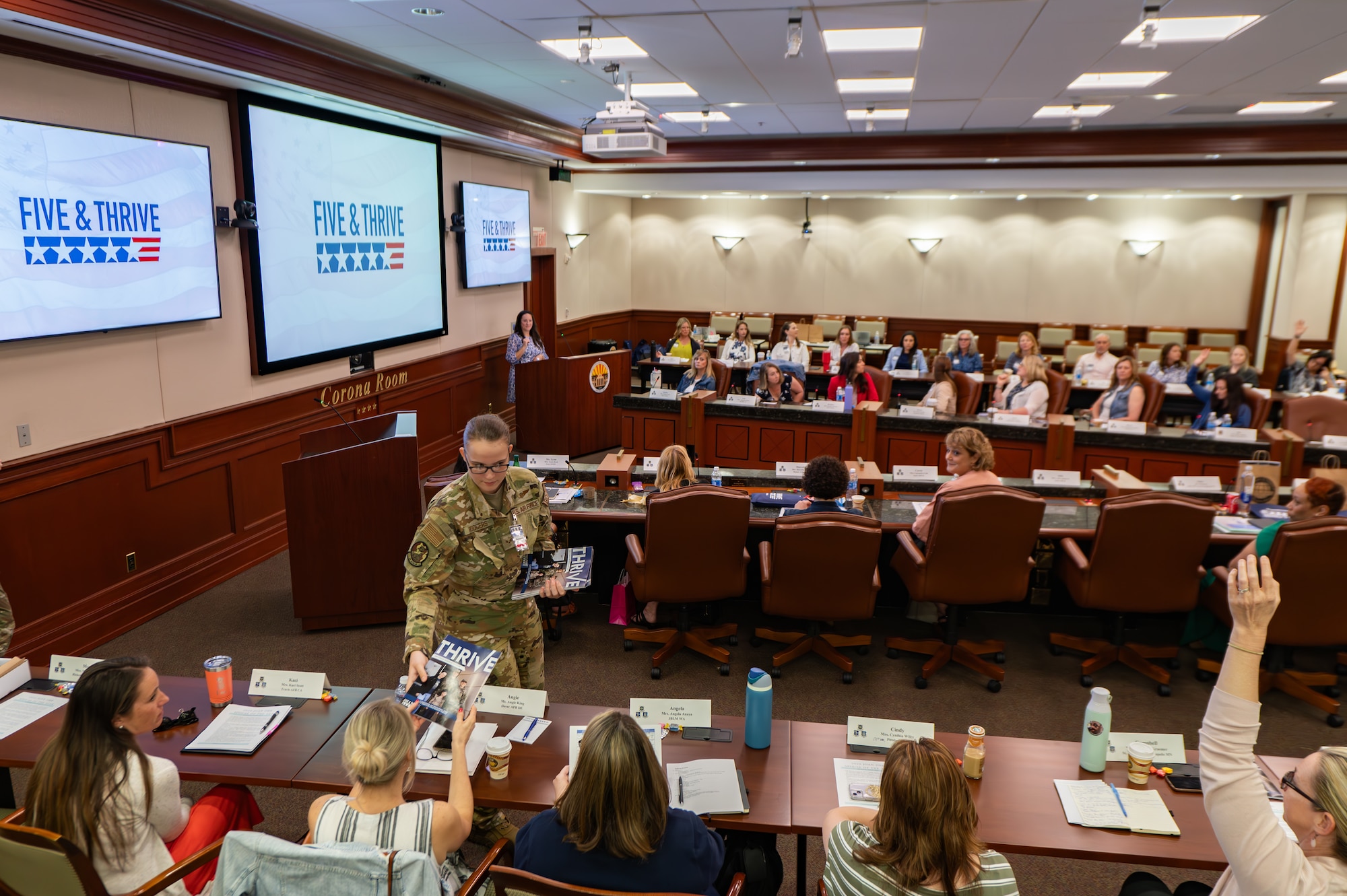 Military spouses listen to a speech during the Five and Thrive discussion at MacDill Air Force Base, Florida, May 1, 2024.