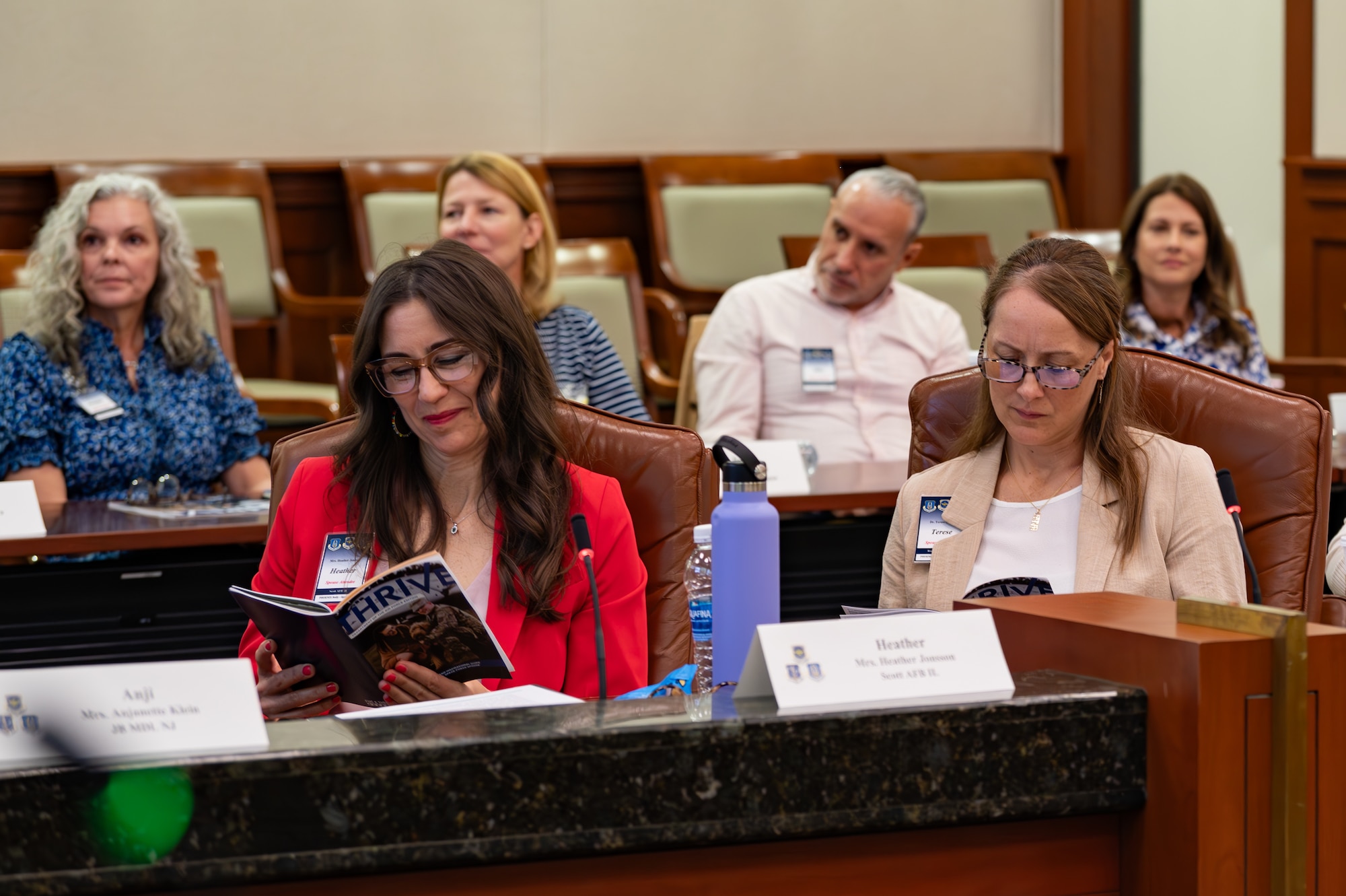 Military spouses read the “Thrive Guide” during the Five and Thrive discussion at MacDill Air Force Base, Florida, May 1, 2024.