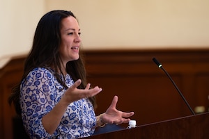 Anne Parker, a member of the thrive team, speaks to a crowd during the Five and Thrive discussion at MacDill Air Force Base, Florida, May 1, 2024.