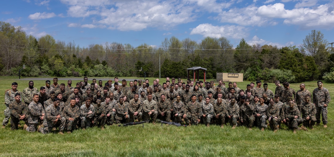 U.S. Marines with Headquarters Battalion pose for a picture during a Battalion meet/ Mess Night in vicinity of Camp Upshur at Marine Corps Base Quantico, Virginia, April 18, 2024. Like so many of our service traditions, the term "Mess Night" and the format used in the U.S. Navy today was derived from the British Navy to honor custom and tradition as a means of respecting the past. (U.S. Marine Corps photo by Cpl. Christopher Zincke)