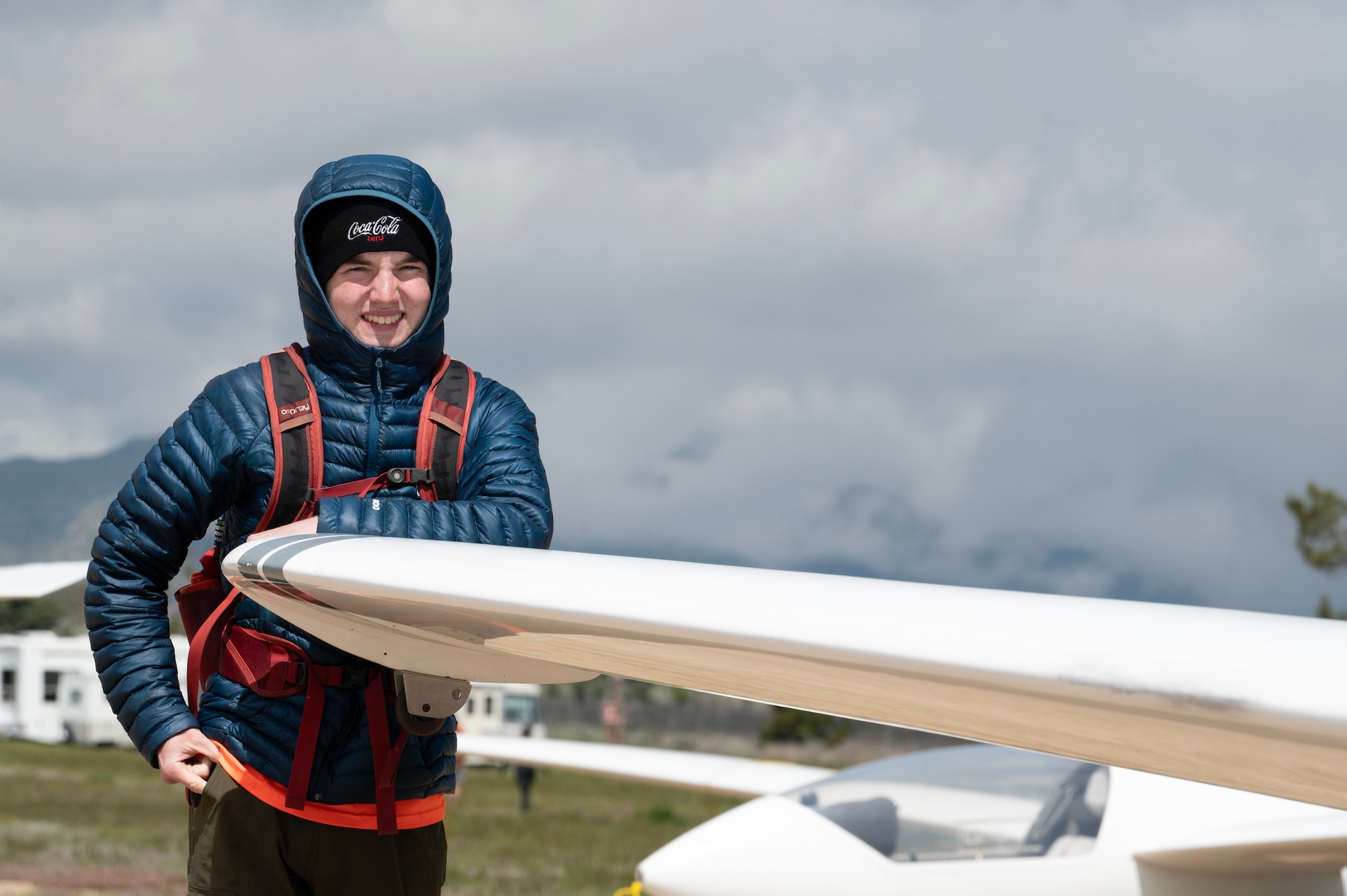 Boy Scout by glider wing