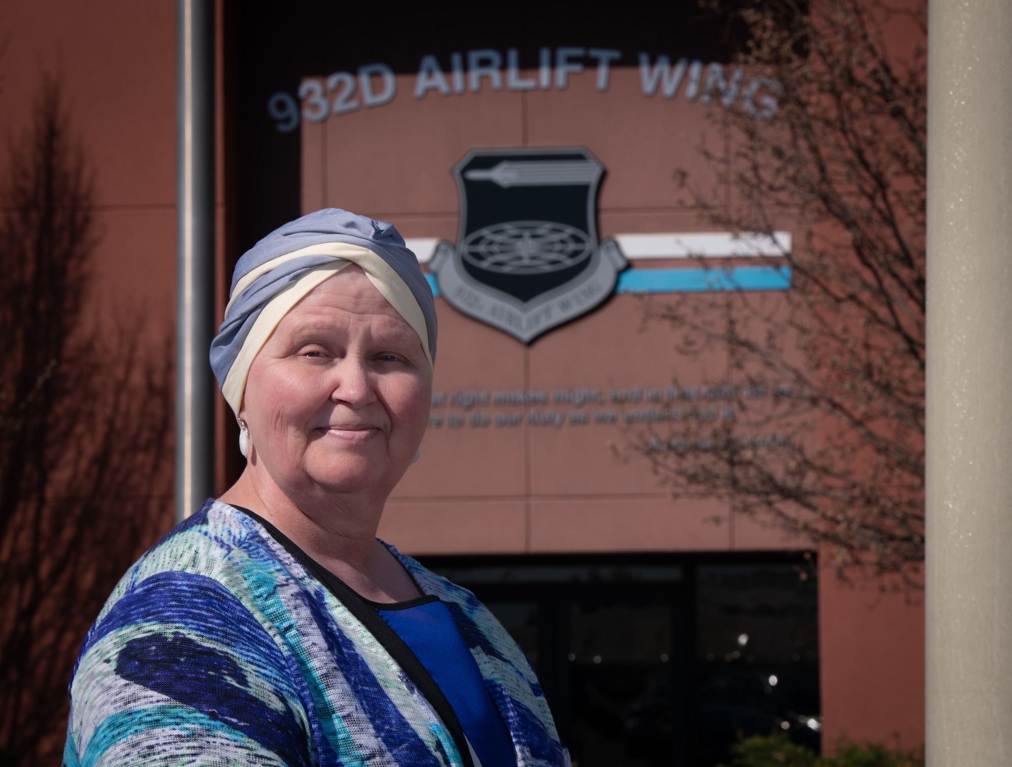 Kenna Collier, recently retired after 33 years of dedicated service, poses for a portrait outside the 932nd Airlift Wing headquarters building, March 6, 2024, Scott Air Force Base, Illinois.  (U.S. Air Force photo by Christopher Parr)