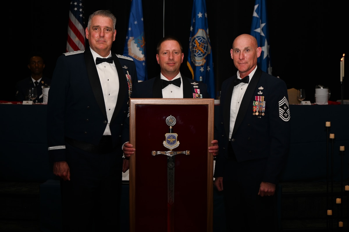 The enlisted force of Air Mobility Command bestowed their most prestigious honor – the Order of the Sword – to Gen. Mike Minihan, AMC commander, at a formal ceremony, May 2, 2024. A tradition whose foundation dates back to the 12th Century, the old “Royal Order of the Sword” ceremony was revised, updated and adopted by the Noncommissioned Officers of the United States Air Force in 1967. Since then, less than 3oo Airmen have had this honor bestowed upon them. Minihan is known for routinely putting personal and genuine investment into the Airmen he leads, tackling issues at both the programmatic and individual level. (U.S. Air Force photo by SrA Jessica Do)