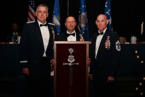 The enlisted force of Air Mobility Command bestowed their most prestigious honor – the Order of the Sword – to Gen. Mike Minihan, AMC commander, at a formal ceremony, May 2, 2024. A tradition whose foundation dates back to the 12th Century, the old “Royal Order of the Sword” ceremony was revised, updated and adopted by the Noncommissioned Officers of the United States Air Force in 1967. Since then, less than 3oo Airmen have had this honor bestowed upon them. Minihan is known for routinely putting personal and genuine investment into the Airmen he leads, tackling issues at both the programmatic and individual level. (U.S. Air Force photo by SrA Jessica Do)