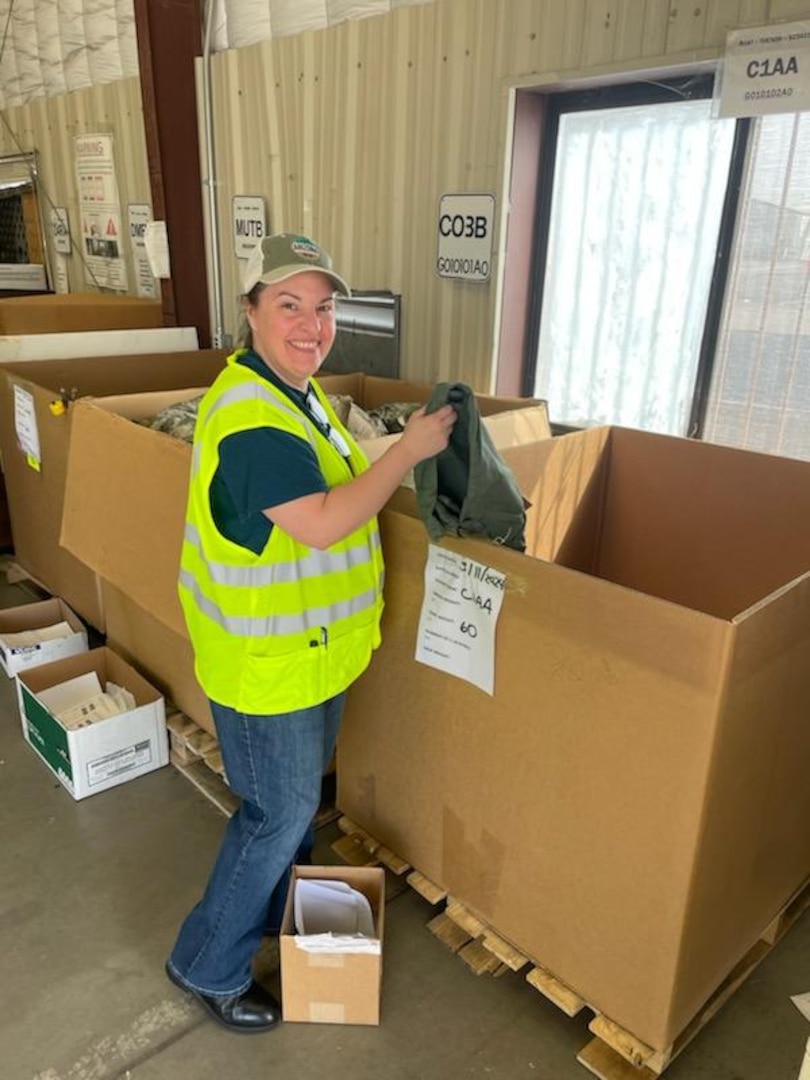 Woman sorting items in box