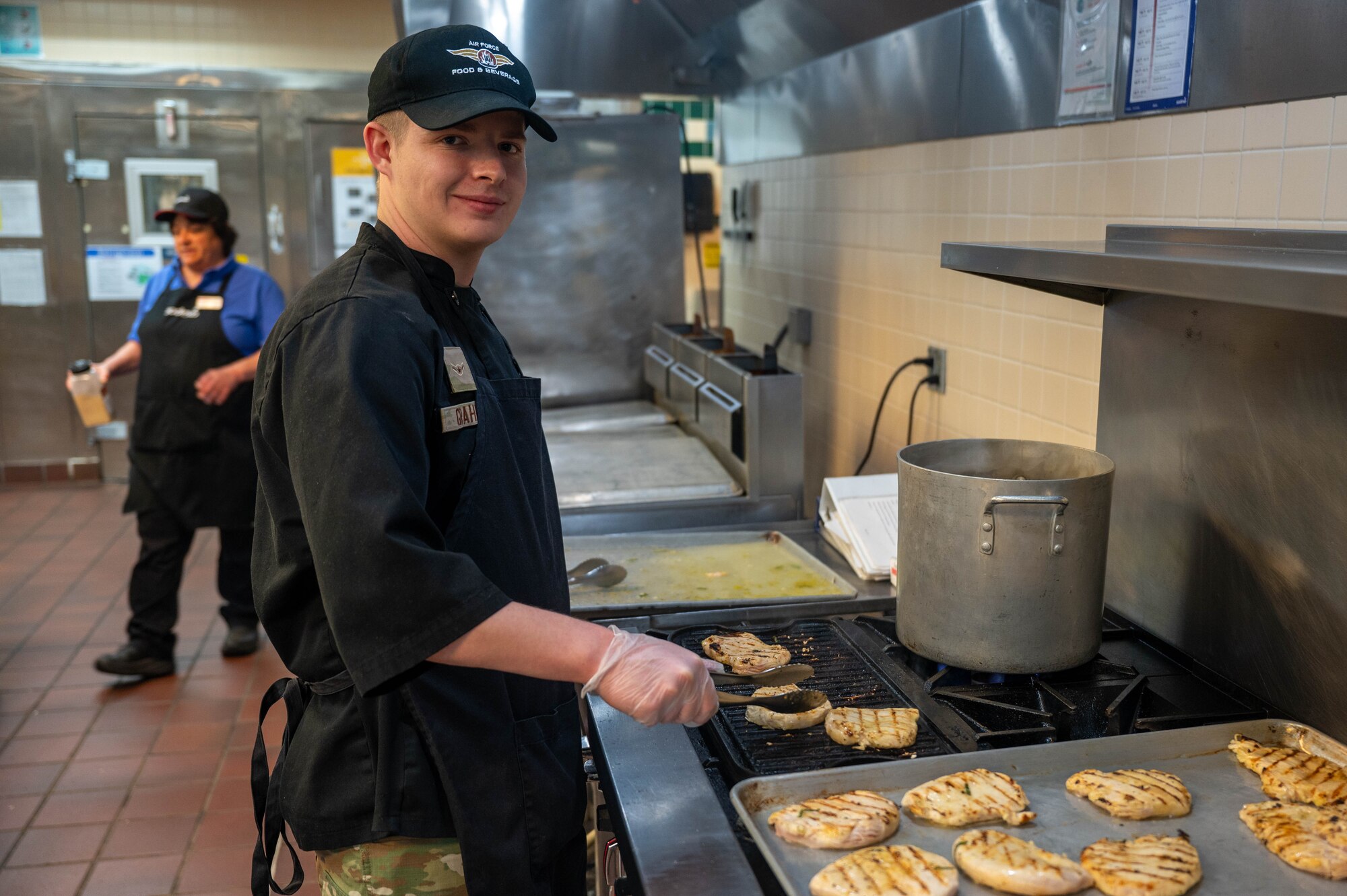 chef posing for photo at grill