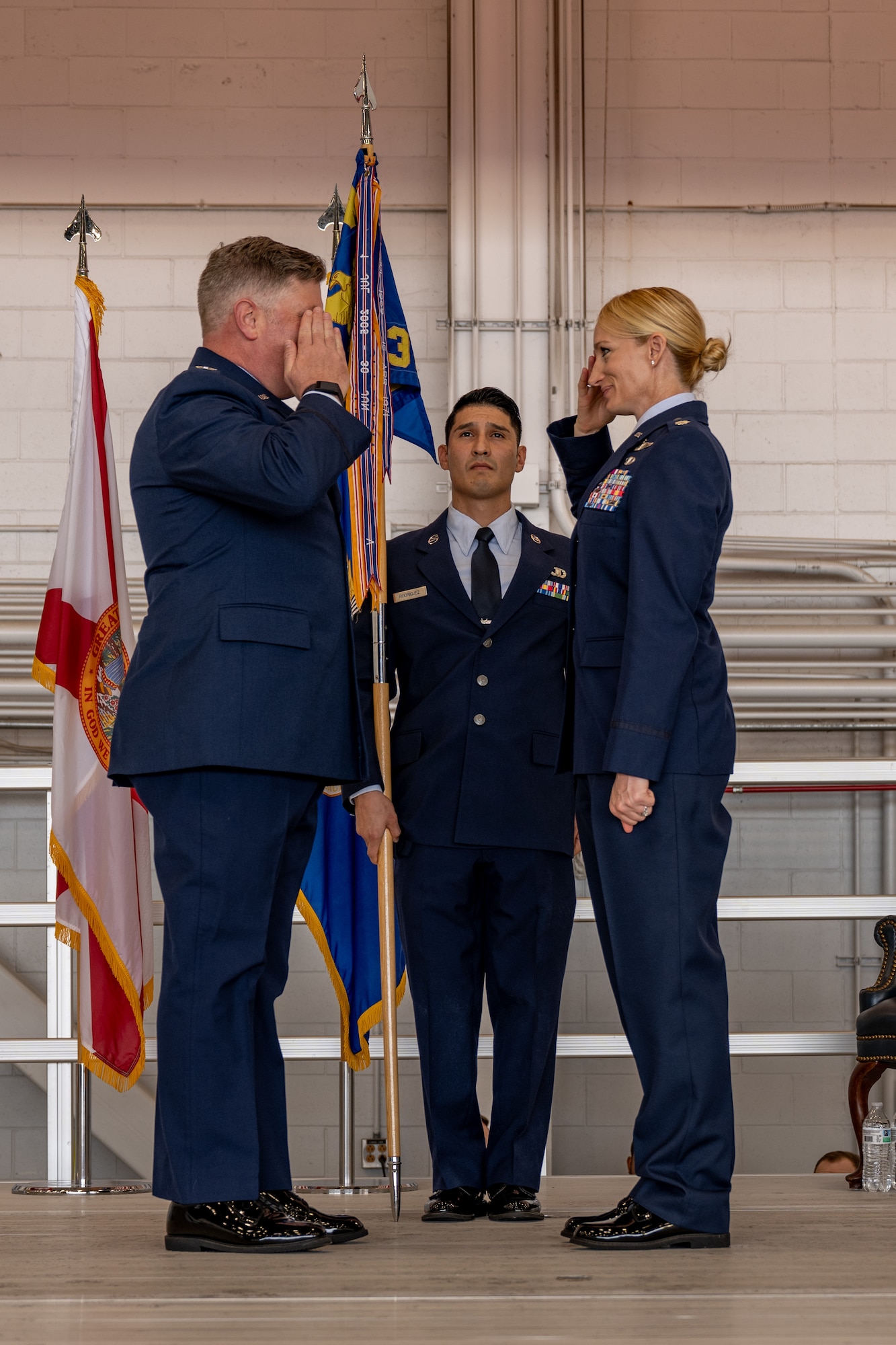 U.S. Air Force Lt. Col Caitlin Reilly, the 319th Special Operations Squadron commander, renders a salute to Col. Adam E. Moore, the 1st Special Operations Group commander, during the 319th SOS change of command and reassignment ceremony at Hurlburt Field, Florida, May 3, 2024. The reassignment of the 319th SOS from the 1st Special Operations Wing to the 492d Special Operations Wing will help Air Force Special Operations Command deploy and sustain power in support of the National Defense Strategy. (U.S. Air Force photo by Senior Airman Hussein Enaya)