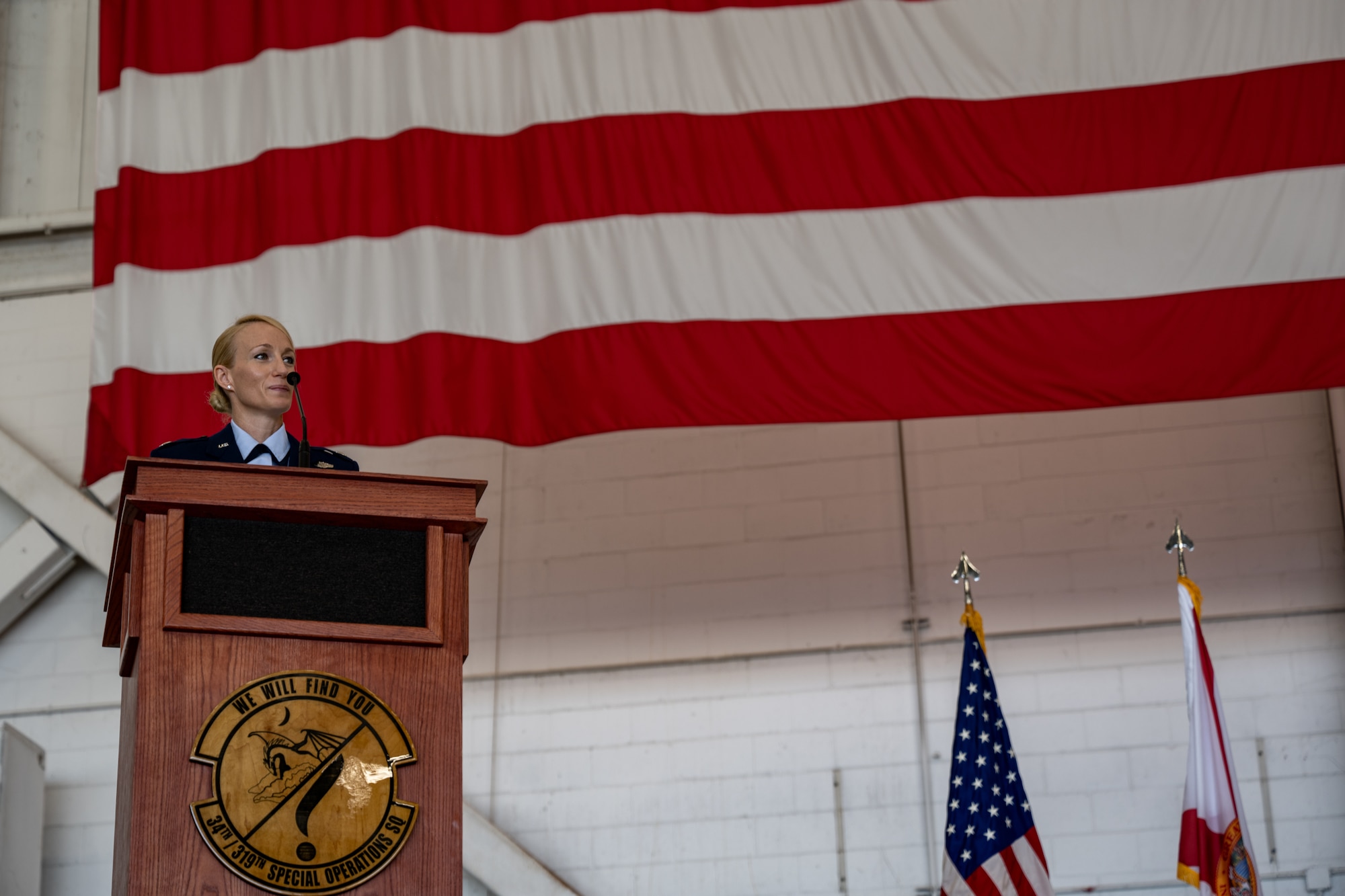 U.S. Air Force Lt. Col Caitlin Reilly, the 319th Special Operations Squadron commander, gives closing remarks during the 319th SOS change of command and reassignment ceremony at Hurlburt Field, Florida, May 3, 2024. The unit reassignment of the 319th SOS is the first of several squadron reassignments associated with a broader initiative by Air Force Special Operation Command to transform the 492d Special Operations Wing into a power projection wing. (U.S. Air Force photo by Senior Airman Hussein Enaya)