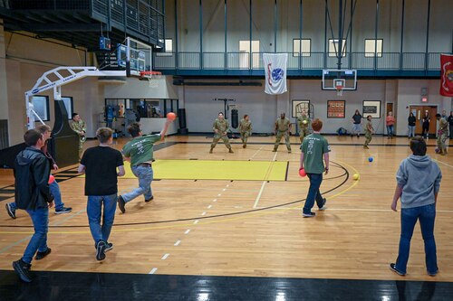 Students and Airmen play a game of dodgeball.