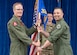 Col. Jared Nelson, commander of the 90th Operations Group, passes the guidon to Lt. Col. Michael Valdivia, the incoming commander of the 320th Missile Squadron, during a change of command ceremony at the Trail's End Event Center on F.E. Warren Air Force Base, Wyoming, May 3, 2024. The change of command ceremony signifies the transition of command from Lt. Col. Aaron Linton, the outgoing commander of 320 MS, to Valdivia. (U.S. Air Force photo by Airman 1st Class Landon Gunsauls.)