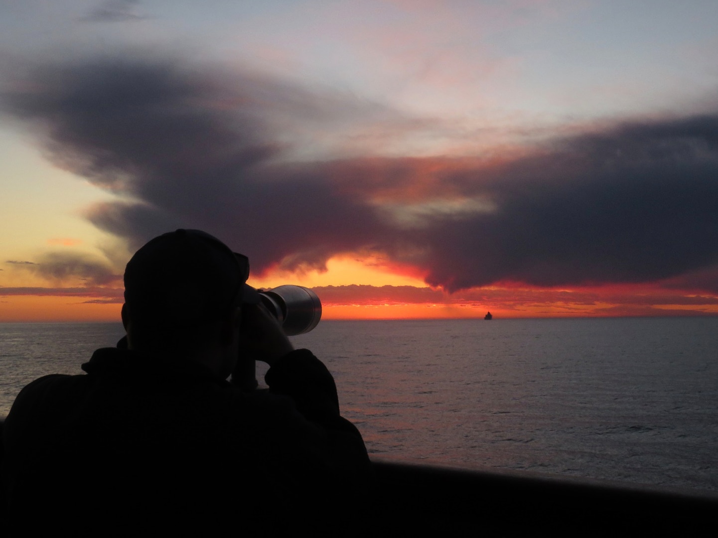Petty Officer 1st Class Brandon Castelletti, a boatswain’s mate aboard the USCGC Active (WMEC 618), uses binoculars to monitor traffic while patrolling off the coast of San Diego, Mar. 18, 2024. The Active’s crew returned home to Port Angeles, Washington, May 3, 2024, after completing a 54-day multi-mission patrol supporting Joint Interagency Task Force-South’s (JIATF-S) counternarcotics patrol in the Eastern Pacific Ocean. U.S. Coast Guard photo by Ens. Thomas Gehman.