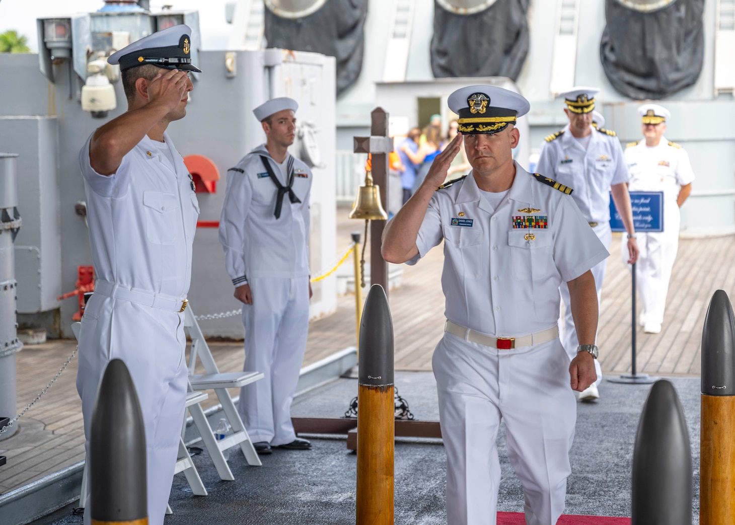 PEARL HARBOR (Nov. 21, 2023) — Cmdr. Daniel Jones, incoming commanding officer of the Virginia-class fast-attack submarine USS Hawaii (SSN 776), arrives at the change of command ceremony for the Hawaii, which was held on the fantail of the Battleship Missouri Memorial, Nov. 21, 2023, in Pearl Harbor. Hawaii performs a full spectrum of operations, including anti-submarine and anti-surface warfare. (U.S. Navy photo by Mass Communication Specialist 1st Class Scott Barnes)