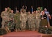 Col. Johnny Galbert, 90th Missile Wing commander, poses with the first quarter award winners at the base theater on F.E. Warren Air Force Base, Wyoming, May 3, 2024.. The Wing held a ceremony to honor the Airmen who went above and beyond in their unit and the wing during the second quarter. (U.S. Air Force photo by Airman 1st Class Landon Gunsauls)
