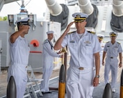 PEARL HARBOR (Nov. 21, 2023) — Cmdr. Preston Gilmore, off-going commanding officer of the Virginia-class fast-attack submarine USS Hawaii (SSN 776), arrives at the change of command ceremony for the Hawaii, which was held on the fantail of the Battleship Missouri Memorial, Nov. 21, 2023, in Pearl Harbor. Hawaii performs a full spectrum of operations, including anti-submarine and anti-surface warfare. (U.S. Navy photo by Mass Communication Specialist 1st Class Scott Barnes)
