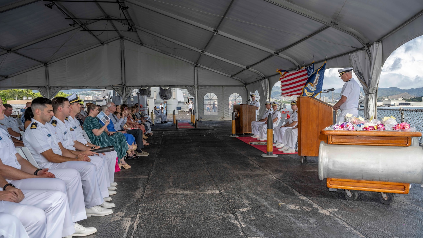 PEARL HARBOR (Nov. 21, 2023) — Cmdr. Preston Gilmore, off-going commanding officer of the Virginia-class fast-attack submarine USS Hawaii (SSN 776), speaks during the change of command ceremony for the Hawaii, which was held on the fantail of the Battleship Missouri Memorial, Nov. 21, 2023, in Pearl Harbor. Hawaii performs a full spectrum of operations, including anti-submarine and anti-surface warfare. (U.S. Navy photo by Mass Communication Specialist 1st Class Scott Barnes)