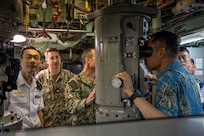 JOINT BASE PEARL HARBOR-HICKAM (April 12, 2024) —  Attendees of the Undersea Warfare Commanders’ Conference (USWCC) tour the Los Angeles-class fast-attack submarine USS Tucson (SSN 770) on Joint Base Pearl Harbor-Hickam, April 12, 2024. First held in 2018, this year’s theme was “Leveraging technology to integrate partners and improve communications, lethality and interchangeability.” (U.S. Navy photo by Mass Communication Specialist 1st Class Scott Barnes)