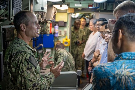 JOINT BASE PEARL HARBOR-HICKAM (April 12, 2024) —  Cmdr. Adam M. Matthews, commanding officer of the Los Angeles-class fast-attack submarine USS Tucson (SSN 770) gives attendees of the Undersea Warfare Commanders’ Conference (USWCC) a tour of the Tucson on Joint Base Pearl Harbor-Hickam, April 12, 2024. First held in 2018, this year’s theme was “Leveraging technology to integrate partners and improve communications, lethality and interchangeability.” (U.S. Navy photo by Mass Communication Specialist 1st Class Scott Barnes)