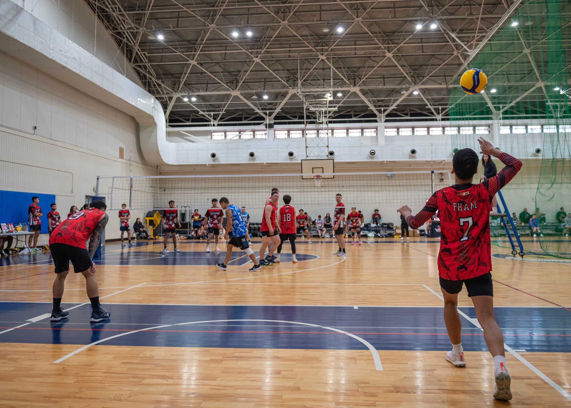Osan Air Base Varsity Volleyball members on Osan S1 compete at the 2024 INDOPACOM Volleyball Tournament at Yokota AB, Japan, April 26, 2024. Osan AB Varsity Volleyball formed two men’s teams, Osan S1 and Osan S2, that competed in the tournament. Osan S1 placed third out of the eight men's teams within the tournament. (U.S. Air Force photo by Staff Sgt. Aubree Owens)