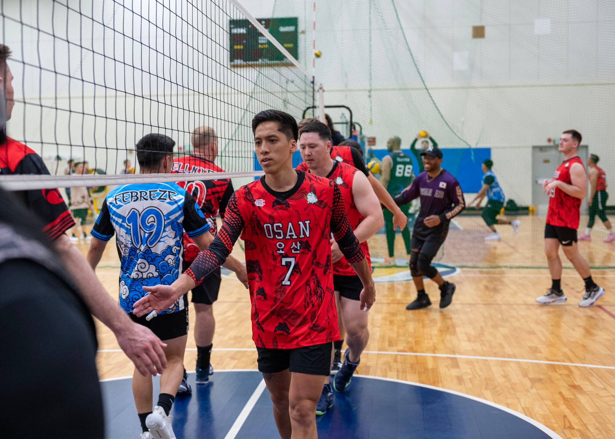 Osan Air Base Varsity Volleyball members on Osan S1 compete at the 2024 INDOPACOM Volleyball Tournament at Yokota AB, Japan, April 26, 2024. Osan AB Varsity Volleyball formed two men’s teams, Osan S1 and Osan S2, that competed in the tournament. Osan S1 placed third out of the eight men's teams within the tournament. (U.S. Air Force photo by Staff Sgt. Aubree Owens)