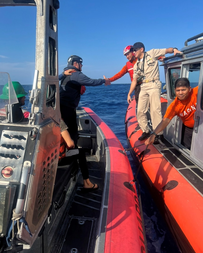 Petty Officer 1st Class Brian Kelley, a maritime enforcement specialist aboard USCGC Active (WMEC 618), shakes hands with Mexican SEMAR personnel prior to conducting a personnel transfer at sea while patrolling the Eastern Pacific Ocean, Mar. 30, 2024. Active regularly patrols international waters off southern Mexico and Central America, working with partner nations to combat transnational organized crime in the Western Hemisphere, specifically the smuggling of narcotics. U.S. Coast Guard photo by Petty Officer 3rd Class Johnny Williams.