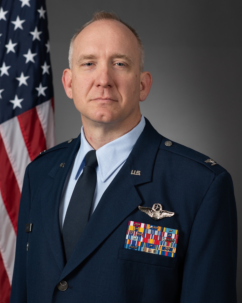 A U.S. Air Force Colonel sits for a portrait in a military uniform