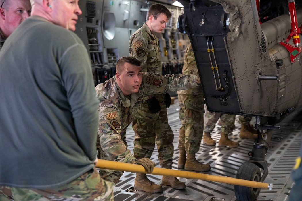 MSgt Michael Zaicko of the 166 LRS assists with the loading of a Delaware National Guard's Army Aviation Blackhawk Helicopter onto an Alaska National Guard C-17 Globemaster III at Trinidad and Tobago during a State Partnership Program mission.