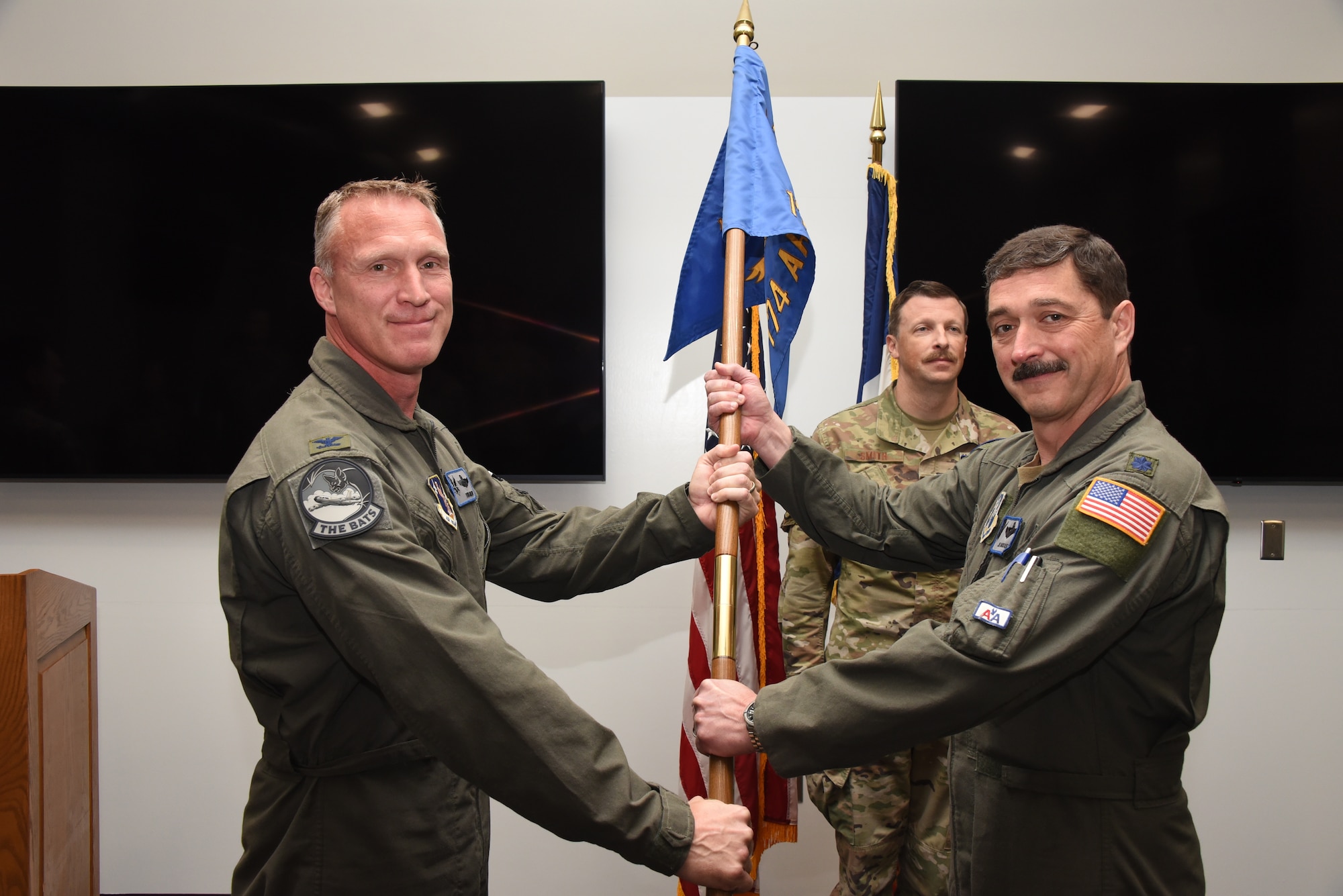 Lt. Col. Joseph Bousquet, right, accepts the unit’s guidon from Col. Todd Miller
