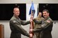 U.S. Air National Guard Lt. Col. Joseph Bousquet, right, accepts the unit’s guidon from Col. Todd Miller, 185th Operations Group Commander, left, as he assumes command of the 174th Air Refueling Squadron during a formal ceremony at the 185th Air Refueling Wing in Sioux City, Iowa, May 5, 2024. Bousquet is replacing Lt. Col. William Poulson as commander of the unit. (U.S. Air National Guard photo by Senior Airman Tylon Chapman)