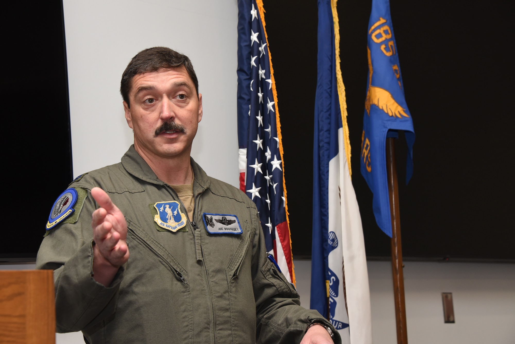 Lt. Col. Joseph Bousquet, 174th Air Refueling Squadron Commander, speaks to unit members