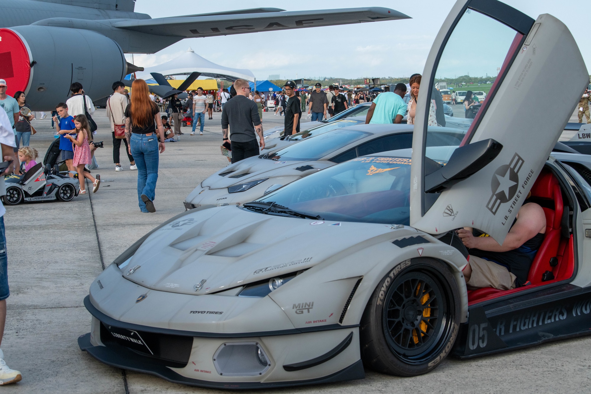Drivers stage their cars on the flight line during America Fest at Kadena Air Base, Japan, April 27, 2024.
