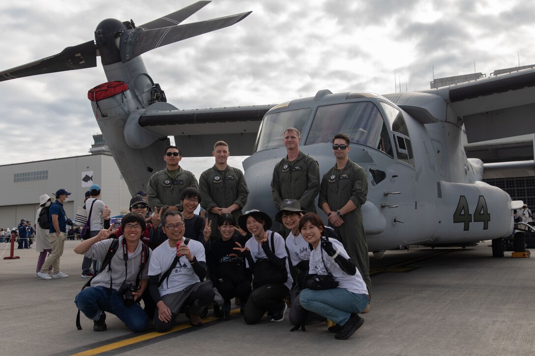 U.S. Marines with Marine Medium Tiltrotor Squadron (VMM) 262, Marine Aircraft Group 36, and guests pose for a photo in front of an MV-22B Osprey during Marine Corps Air Station Iwakuni's 45th Friendship Day at MCAS Iwakuni, Japan, May 5, 2024. Since 1973, MCAS Iwakuni has held a Friendship Day open house to foster positive relationships between the air station and its Japanese hosts, offering a culturally enriching experience that displays the mutual support the U.S. and Japan share. (U.S. Marine Corps photo by Sgt. Lance Kell)