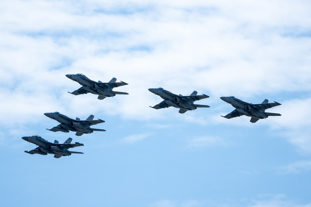 U.S. Navy F/A-18E Super Hornet, F/A-18F Super Hornet, and EA-18G Growler aircraft assigned to Carrier Air Wing (CVW) 5, Carrier Strike Group 5, fly in formation during Marine Corps Air Station Iwakuni’s 45th Friendship Day at MCAS Iwakuni, Japan, May 5, 2024. Since 1973, MCAS Iwakuni has held a Friendship Day open house to foster positive relationships between the air station and its Japanese hosts, offering a culturally enriching experience that displays the mutual support the U.S. and Japan share. (U.S. Marine Corps photo by Cpl. Raymond Tong)