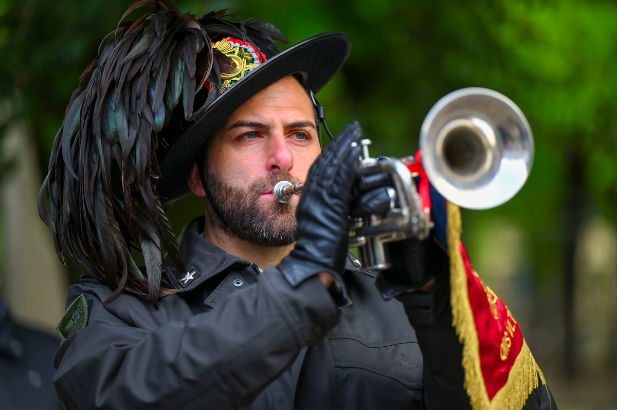 Infantry member playing a bugle.